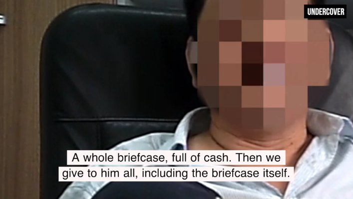 Undercover footage of Chinese logging executive in Republic of Congo alleging bribery of Minister Henri Djombo, © EIA
